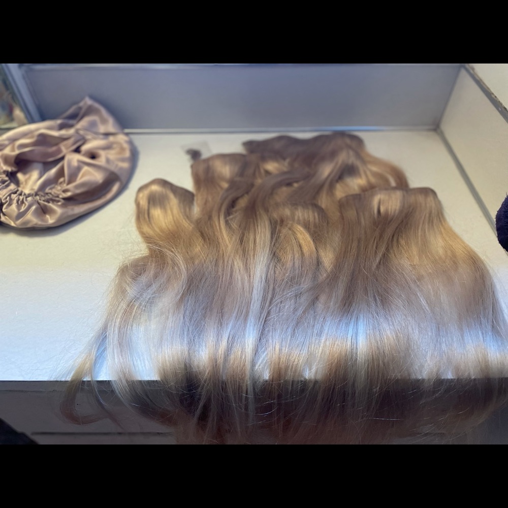 Un-used, opened real human hair extensions